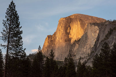 Low angle view of rock formations against sky