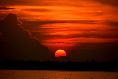 Scenic view of sea against romantic sky at sunset