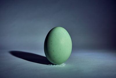 Close-up of green ball on table