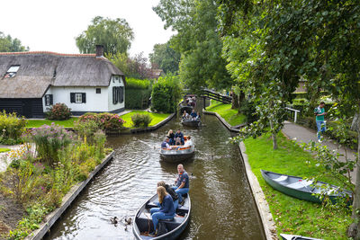 Giethoorn, netherlands - 13 september 2020. tourists sailing on rented boats on the canal.