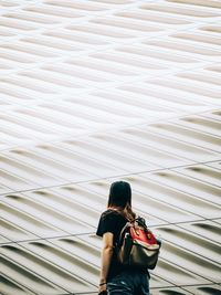 Rear view of woman with umbrella