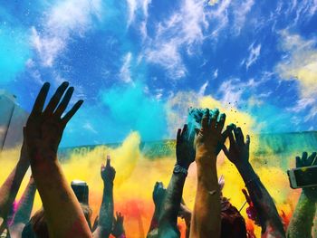 Panoramic shot of hands against sky