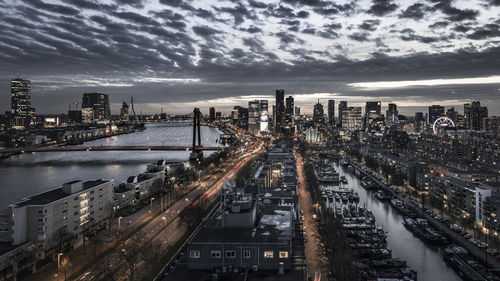 High angle view of city by buildings against sky