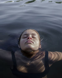 Portrait of a young woman in water