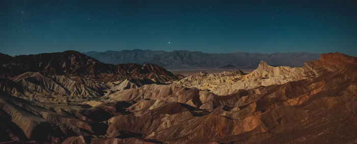 Scenic view of mountains at night