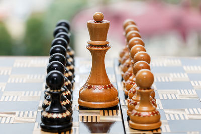 Close-up of chess pieces on table