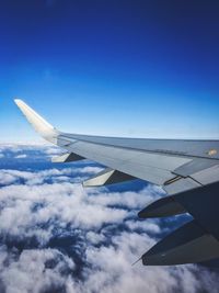 Airplane flying against sky