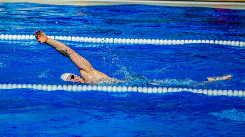 Swimming in swimming pool 