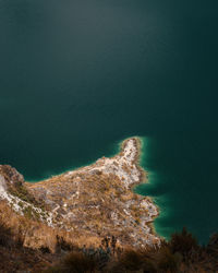 Scenic view of sea by mountain