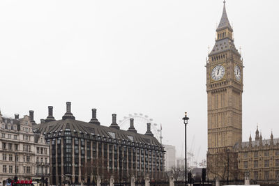 Low angle view of clock tower against sky