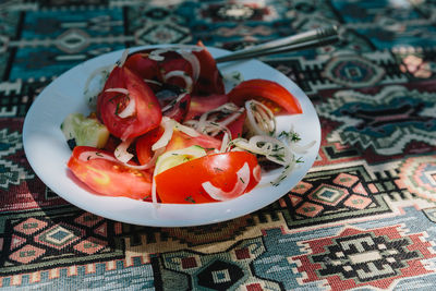 High angle view of fruits in plate on table