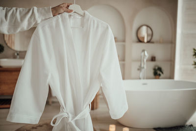 Rear view of woman in bathroom