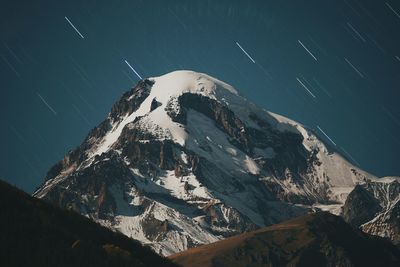 Snow covered landscape at night