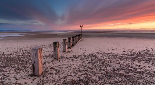 Scenic view of calm sea at sunset