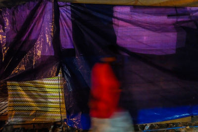 Close-up of clothes hanging on cable