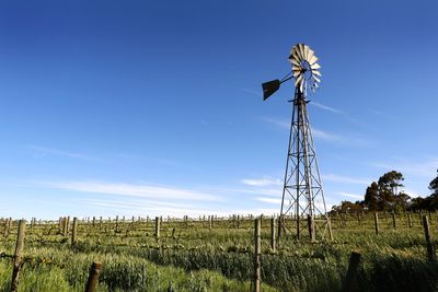 Low angle view of american style windmill against sky