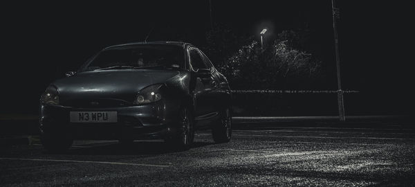 Illuminated car at night