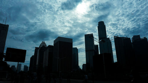 Low angle view of buildings against sky in city