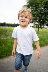 Cute boy standing outdoors