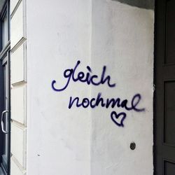 Close-up of text on wall