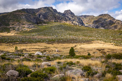 Scenic view of landscape and mountains against sky