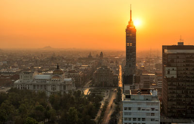 Cityscape against sky during sunset