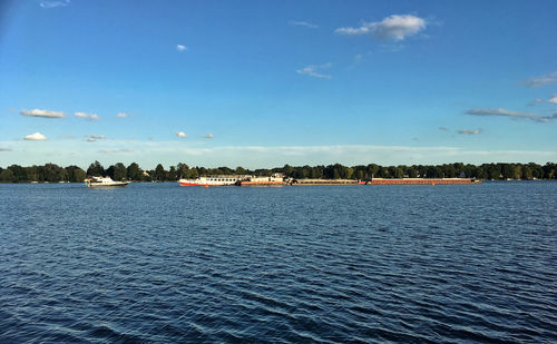 Scenic view of sea against blue sky