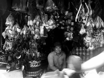 Midsection of man sitting in illuminated temple