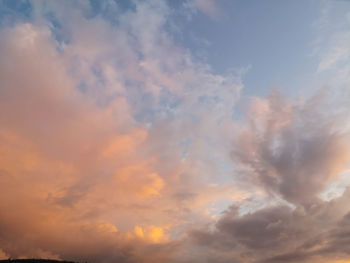 Low angle view of dramatic sky during sunset