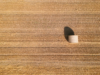 High angle view of hay bale on field