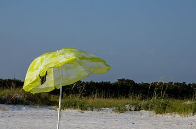 Yellow umbrella on the beach