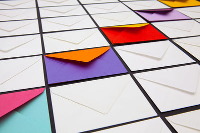 High angle view of multi colored umbrellas on tiled floor