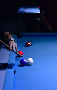 Person playing with ball on table