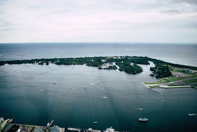 High angle view of sailboats on sea against sky