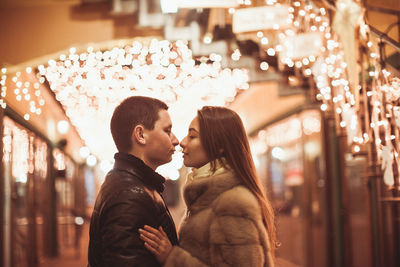 Side view of couple kissing