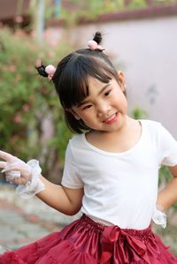 Portrait of cute girl holding outdoors