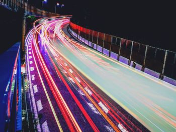 High angle view of light trails on highway at night