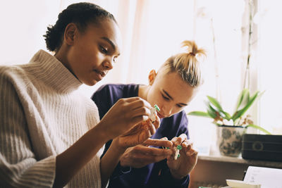 Portrait of young woman looking at camera