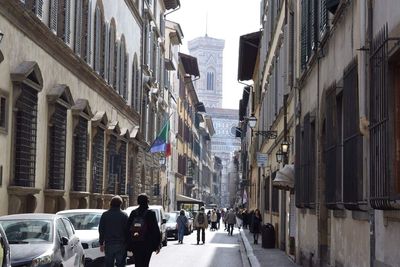 People walking on street in city