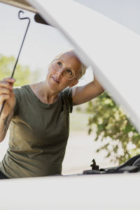 Woman opening bonnet