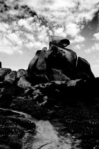 Low angle view of statue against rock formation