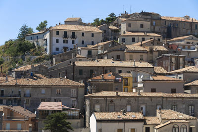 Buildings in town against sky