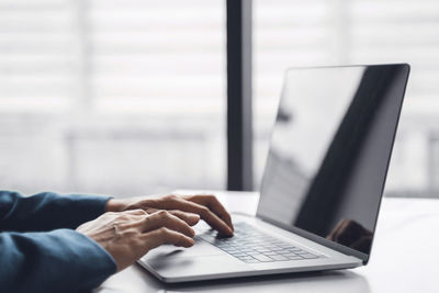Man using laptop on table