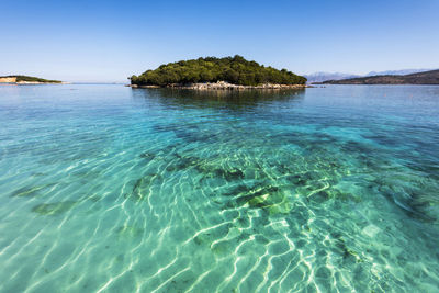 Scenic view of sea against clear sky