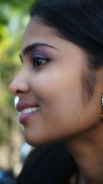 Close-up portrait of beautiful woman looking away