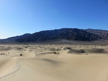 Scenic view of desert against clear sky