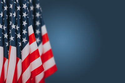 Low angle view of flag against blue sky