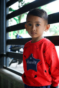 Portrait of boy standing outdoors