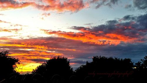 Low angle view of cloudy sky at sunset