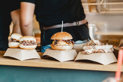 Burgers at a burger feast. dinner hamburger food feast party. big burger at street food outdoor